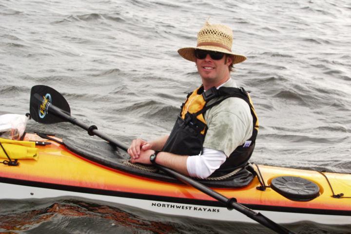 Man smiling in a kayak